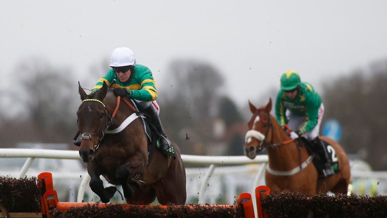 Buveur D'Air ridden by Barry Geraghty (left) clear an early fence before going on to win The Unibet Christmas Hurdle Race run during the 32Red Winter Festi