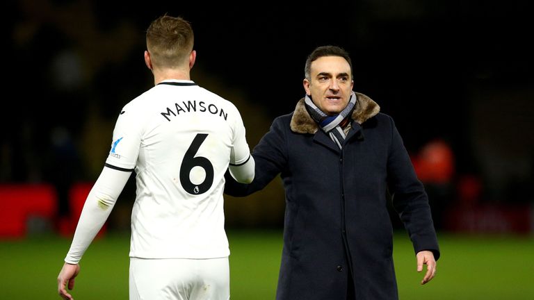 Swansea Manager Carlos Carvalhal celebrates the teams win with Alfie Mawson after the final whistle during the Premier League