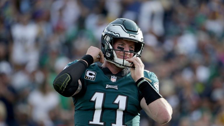 LOS ANGELES, CA - DECEMBER 10:  Quarterback Carson Wentz #11 of the Philadelphia Eagles adjusts his helmet after being hit against the Los Angeles Rams dur