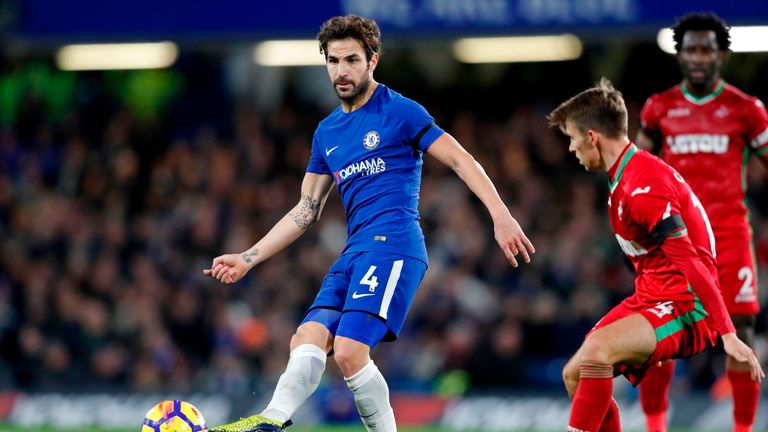 Chelsea's Spanish midfielder Cesc Fabregas passes the ball during the English Premier League football match between Chelsea and Swansea City at Stamford Br