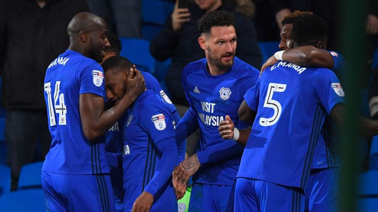 CARDIFF, WALES - DECEMBER 01: Cardiff player Junior Hoilett (2nd left) is congratulated by team mates after scoring the second Cardiff goal during the Sky 