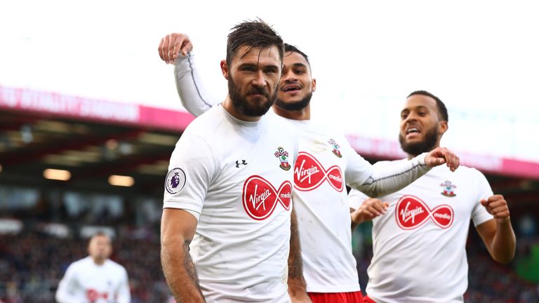 BOURNEMOUTH, ENGLAND - DECEMBER 03: Charlie Austin of Southampton celebrates after scoring his sides first goal with Sofiane Boufal of Southampton and Ryan