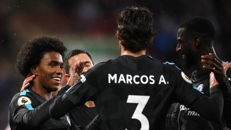 HUDDERSFIELD, ENGLAND - DECEMBER 12:  Willian of Chelsea celebrates scoring the 2nd Chelsea goal with team mates during the Premier League match between Hu