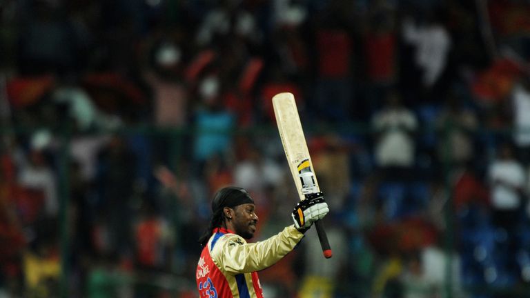 RESTRICTED TO EDITORIAL USE. MOBILE USE WITHIN NEWS PACKAGE Royal Challengers Bangalore batsman Chris Gayle celebrates his century (100 runs) during the IP