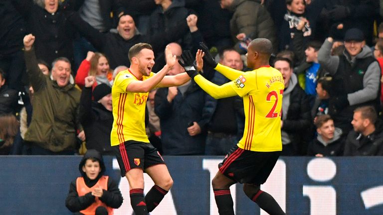 Watford's Christian Kabasele, right, celebrates scoring the opening goal against Spurs with Tom Cleverley