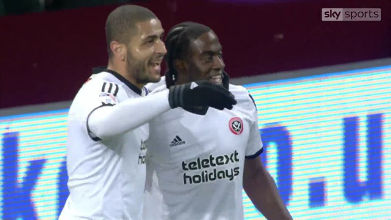 Clayton Donaldson celebrates with team-mate Leon Clarke after scoring Sheffield United's equaliser