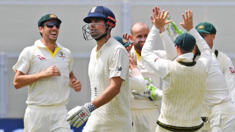 England batsman Alastair Cook (2/L) walks off after being caught by Australia's Steve Smith (2/R) on the third day of the second Ashes cricket Test match i
