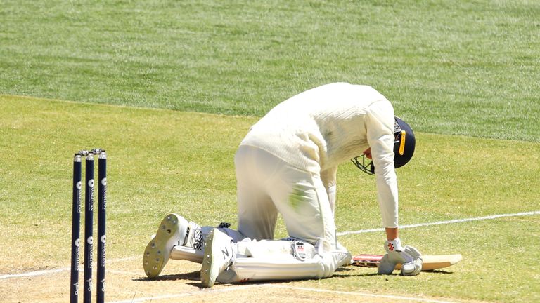 ADELAIDE, AUSTRALIA - DECEMBER 06:  Craig Overton of England goes to the ground after being hit while batting during day five of the Second Test match duri