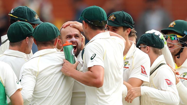 Nathan Lyon of Australia celebrates dismissing Alastair Cook of England for lbw after a successful DRS review during day four of the second Ashes Test