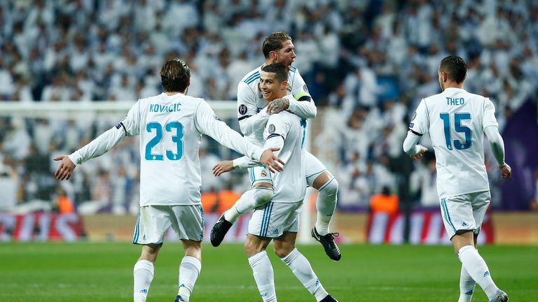 MADRID, SPAIN - DECEMBER 06: Cristiano Ronaldo of Real Madrid celebrates after scoring his sides second goal with his Real Madrid team mates during the UEF