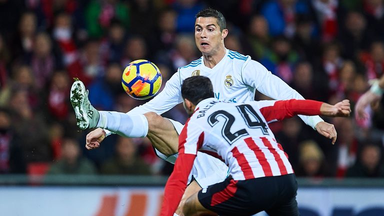 Cristiano Ronaldo is challenged by Mikel Balenziaga of Athletic Club
