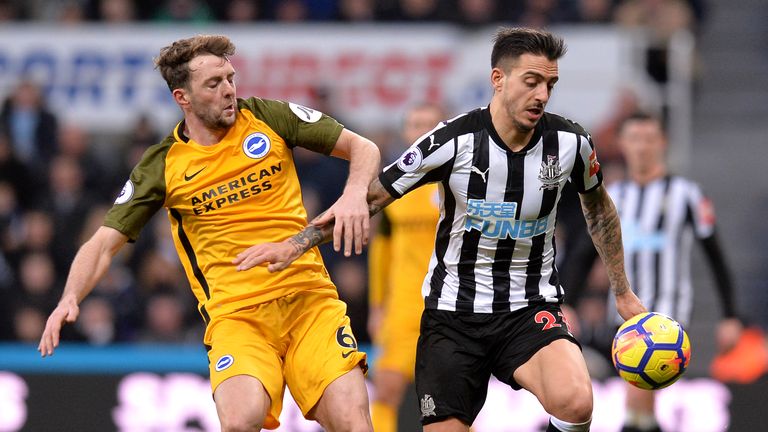 NEWCASTLE UPON TYNE, ENGLAND - DECEMBER 30:  Joselu of Newcastle United and Dale Stephens of Brighton and Hove Albion battle for possession during the Prem