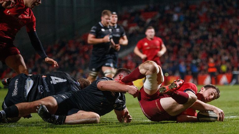 Munster's Darren Sweetnam goes over for his sides second try
