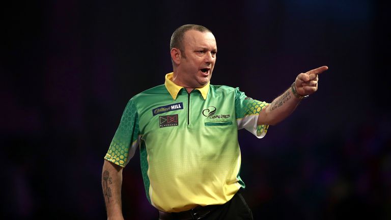 Darren Webster celebrates during his match against Devon Petersen on day eight of the William Hill World Darts Championship