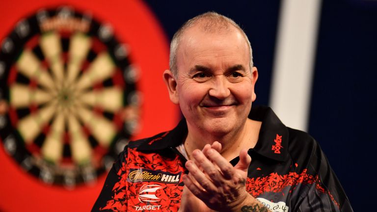 Phil Taylor celebrates after winning his Third Round Match against Keegan Brown during the 2018 William Hill PDC World Darts 