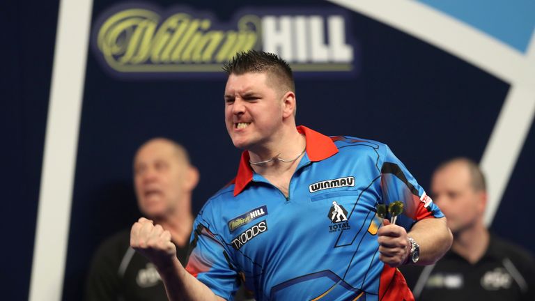 Daryl Gurney celebrates his win on day five of the William Hill World Darts Championship at Alexandra Palace