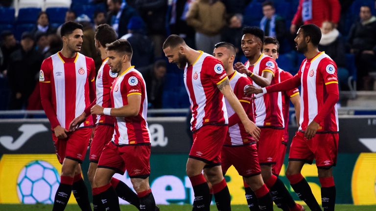 BARCELONA, SPAIN - DECEMBER 11:  Players of Girona FC celebrate after their teammate David Timor scored the opening goal during the La Liga match between R