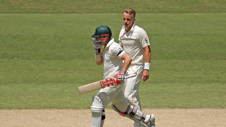 MELBOURNE, AUSTRALIA - DECEMBER 26:  David Warner of Australia celebrates after reaching his century as bowler Tom Curran of England looks on during day on