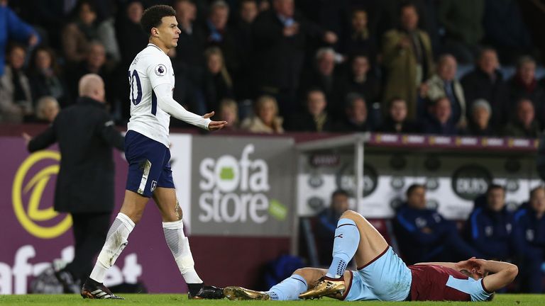 Tottenham's Dele Alli looks on after fouling Burnley's Charlie Taylor.