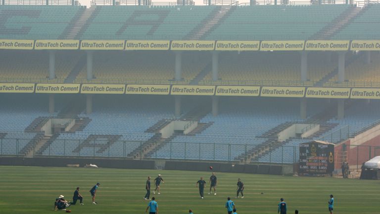 NEW DELHI, INDIA - OCTOBER 27:  The Australia team warm up as early morning smog surrounds the Australian cricket team nets session at the Ferozeshah Kotla