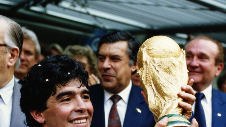 Diego Maradona of Argentina lifts the trophy and celebrates winning the FIFA World Cup final on 29 June 1986 against West Germany at the Azteca Stadium
