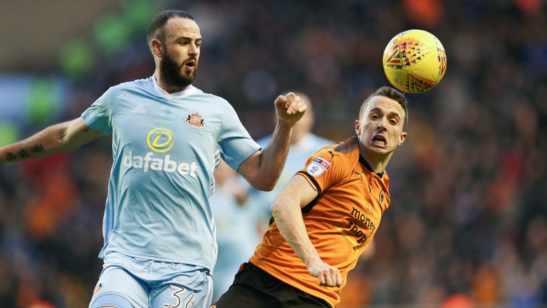 Diogo Jota and Marc Wilson in action during the Sky Bet Championship match at Molineux