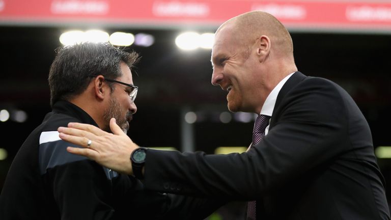 BURNLEY, ENGLAND - SEPTEMBER 23:  David Wagner, Manager of Huddersfield Town and Sean Dyche, Manager of Burnley embrace prior to the Premier League match b