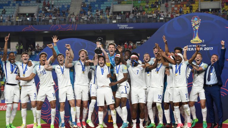 England's players celebrate with the trophy during the awards ceremony after winning the U-20 World Cup final football match between England and Venezuela 