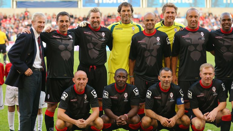 SALFORD, ENGLAND - AUGUST 07: Former Manchester United youth coach Eric Harrison, left, lines up with Gary Neville, second left, and other members of the C