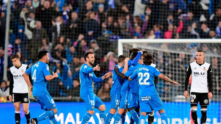 Getafe's players celebrate after scoring a goal during the Spanish league football match Getafe CF vs Valencia CF at the Col. Alfonso Perez stadium in Geta