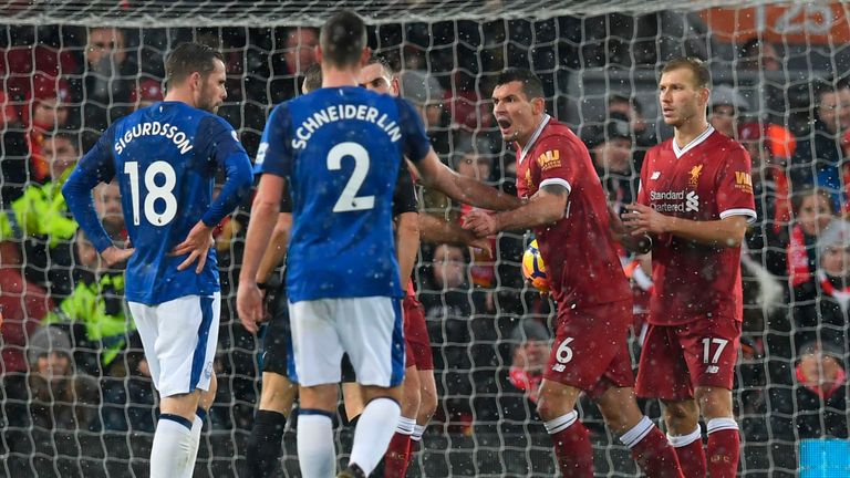 Liverpool's Croatian defender Dejan Lovren (2R) remonstrates with referee Craig Pawson (C obscured) after Lovren conceded a penalty during the English Prem
