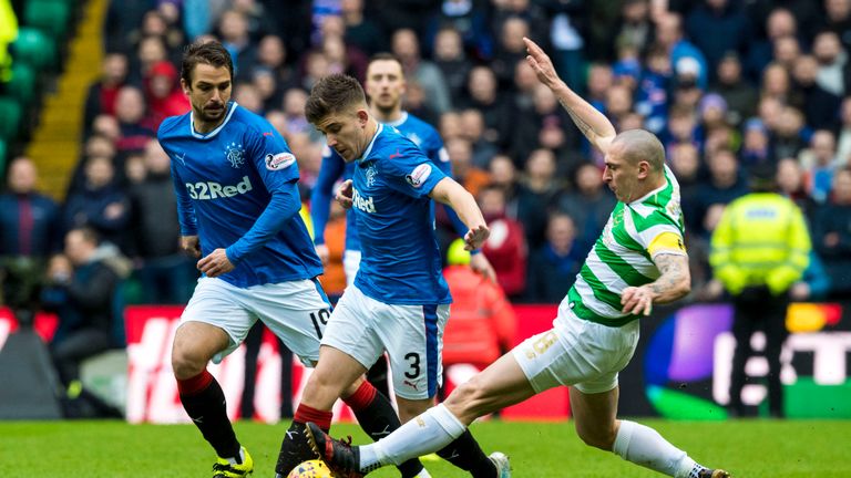 Celtic's Scott Brown (right) tackles Rangers' Declan John