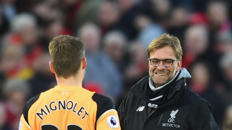 LIVERPOOL, ENGLAND - MARCH 12: Simon Mignolet of Liverpool (L) and Jurgen Klopp, Manager of Liverpool (R) celebrate together after the Premier League match