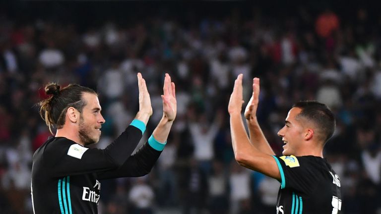 Real Madrid's Welsh forward Gareth Bale (L) is congratulated after scoring by teammate Spanish forward Lucas Vázquez (R) during the FIFA Club World Cup se