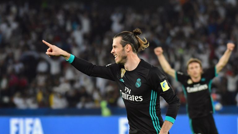 Real Madrid's Welsh forward Gareth Bale (C) celebrates after scoring during the FIFA Club World Cup semi-final match in the Emirati capital Abu Dhabi on De