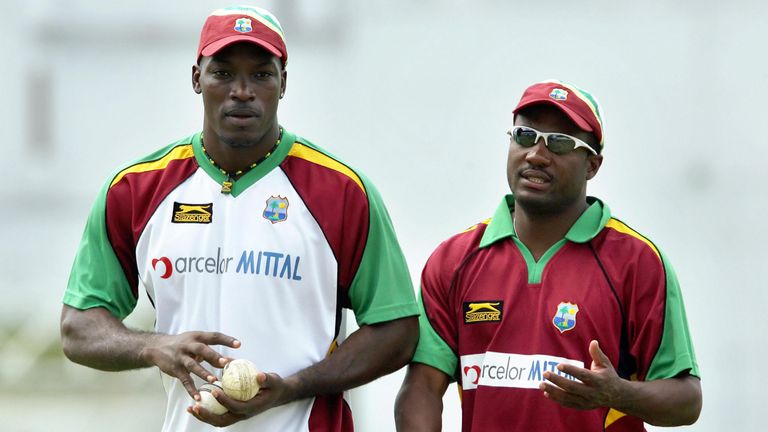 St John's, ANTIGUA AND BARBUDA: West Indies cricketer Chris Gayle (R) listens to captain Brian Lara during a practice session at the Antigua Recreation Gro