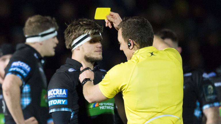 Turner is shown a yellow card by referee Matt Carley following his off-the-ball discretion 