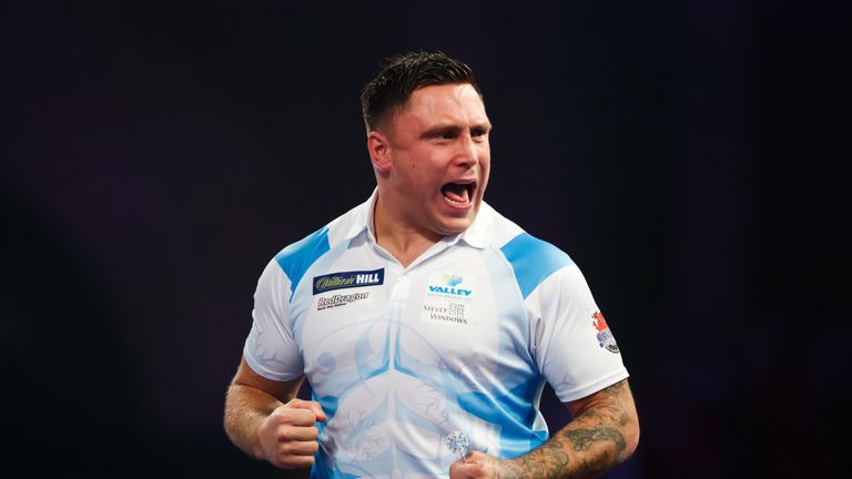Gerwyn Price celebrates during his match against Michael van Gerwen on day eleven of the William Hill World Darts Championship