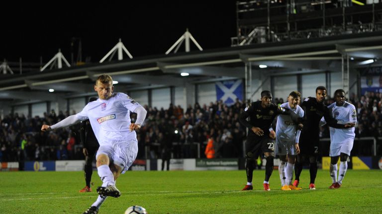 KIRKHAM, ENGLAND - DECEMBER 01: Danny L. Rowe of AFC Fylde scores a penality during The Emirates FA Cup Second Round match between AFC Fylde and Wigan Athl