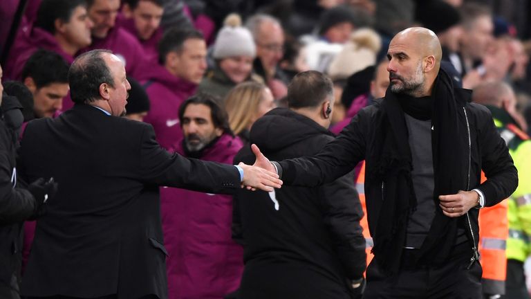 NEWCASTLE UPON TYNE, ENGLAND - DECEMBER 27:  Rafael Benitez, Manager of Newcastle United shakes hands with Josep Guardiola, Manager of Manchester City afte