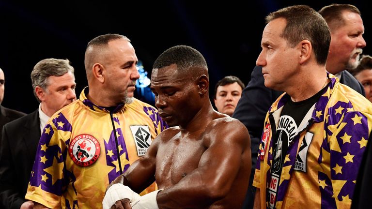 Guillermo Rigondeaux reacts after retiring from his Junior Lightweight bout due to a left hand injury against Vasiliy Lomachen