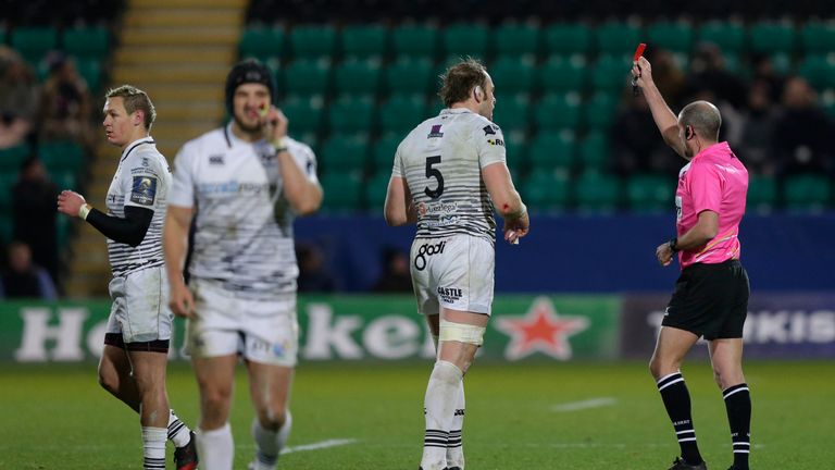 Hanno Dirksen of Ospreys (l) is shown a red card during the European Rugby Champions Cup match with Northampton