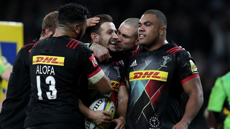 LONDON, ENGLAND - DECEMBER 30 2017:  Danny Care of Harlequins celebrates with team-mates after scoring his team's fourth try against Saints