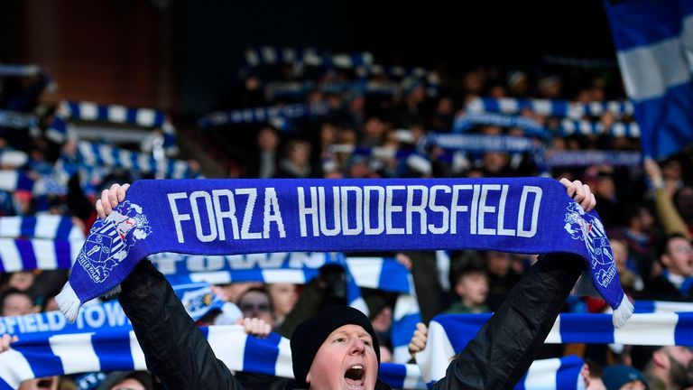 Huddersfield fans are seen ahead of kick off of the English Premier League football match between Huddersfield Town and Brighton and Hove Albion at the Joh