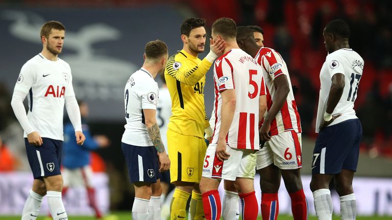 Hugo Lloris of Tottenham Hotspur and Kevin Wimmer of Stoke City speak after the Premier League match at Wembley