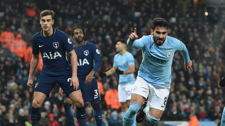 Ilkay Gundogan (R) celebrates after opening the scoring at the Etihad