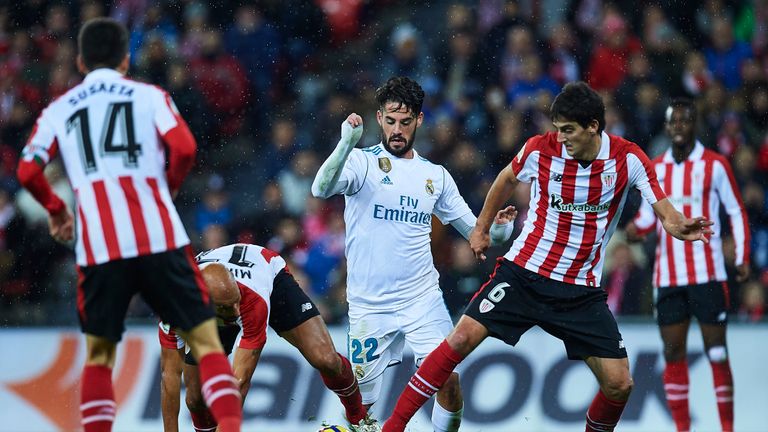 BILBAO, SPAIN - DECEMBER 02:  Isco Alarcon of Real Madrid CF (C) being followed by Mikel Rico of Athletic Club (L) and Mikel San Jose of Athletic Club (R) 