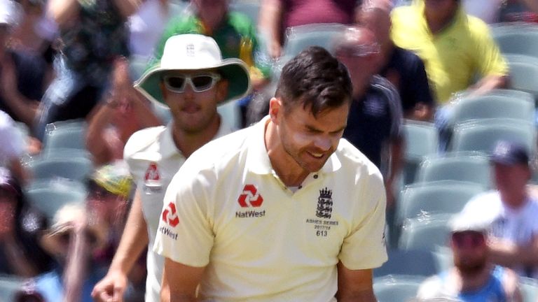 England paceman James Anderson (C) celebrates dismissing Australian batsman Peter Handscomb on the fourth day of the second Ashes cricket Test match in Ade