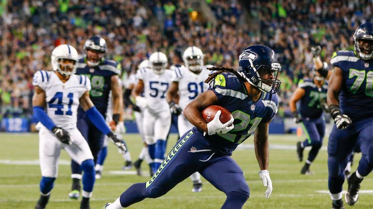 SEATTLE, WA - OCTOBER 01: Running back J.D. McKissic #21 of the Seattle Seahawks scores a touchdown against the Indianapolis Colts in the third quarter of 