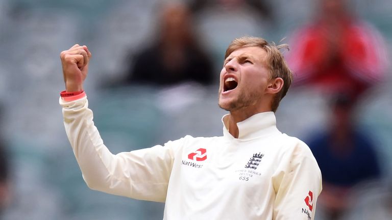 England's captain Joe Root celebrates dismissing Australia's David Warner on the final day of the fourth Ashes cricket Test match at the MCG in Melbourne o